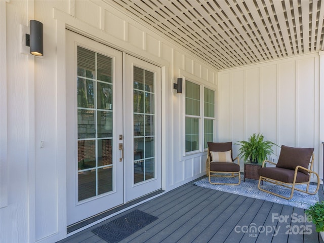 wooden deck featuring french doors