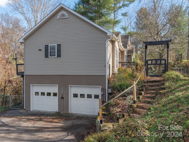 view of home's exterior with a garage