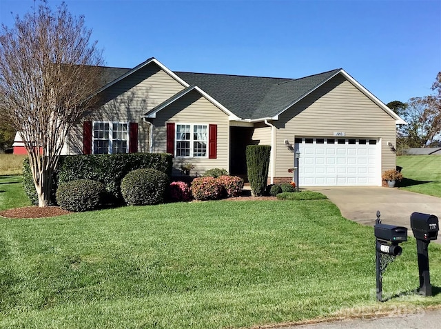 ranch-style home featuring an attached garage, driveway, roof with shingles, and a front yard