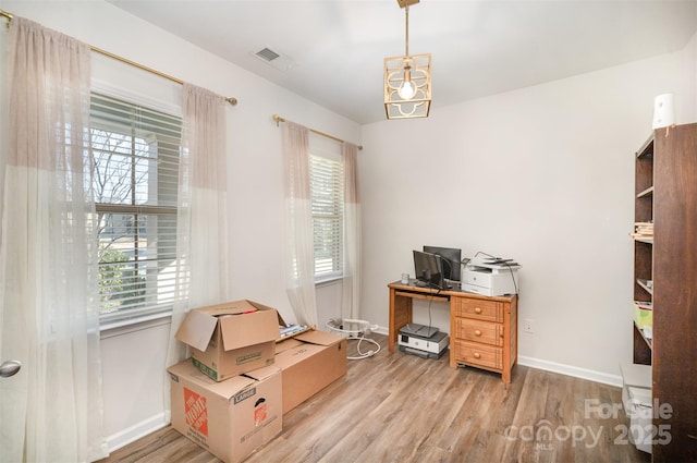 office area featuring light hardwood / wood-style flooring and a wealth of natural light