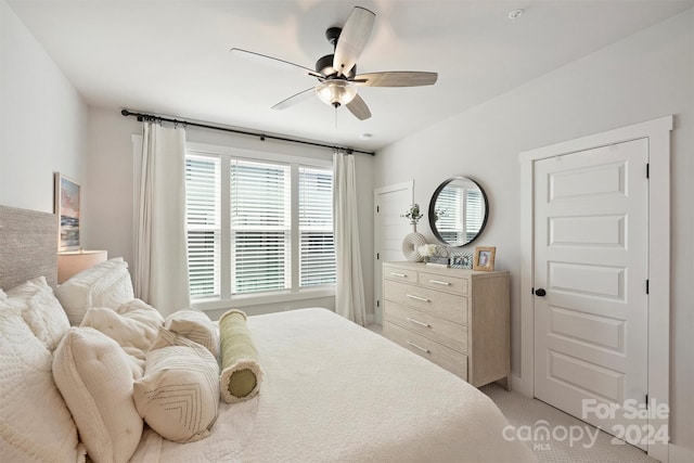 carpeted bedroom with ceiling fan