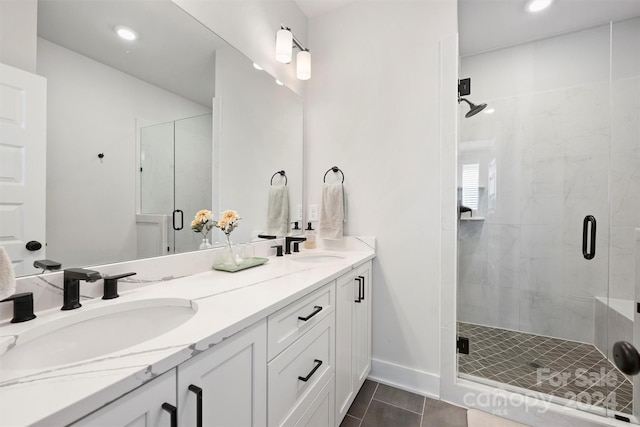 bathroom featuring vanity, an enclosed shower, and tile patterned flooring