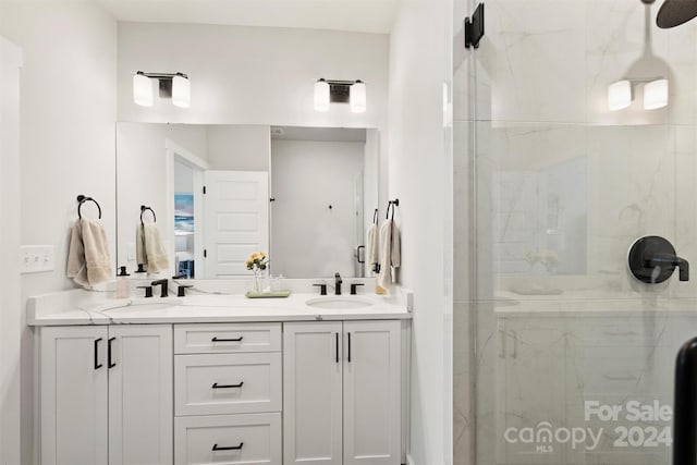 bathroom featuring walk in shower and vanity