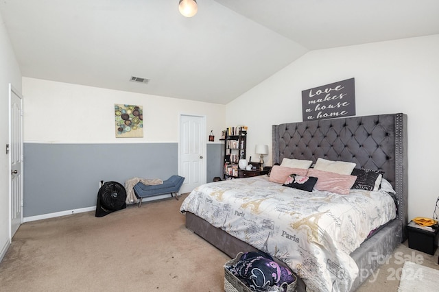 bedroom featuring carpet flooring and lofted ceiling