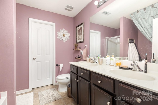 bathroom with walk in shower, vanity, and toilet