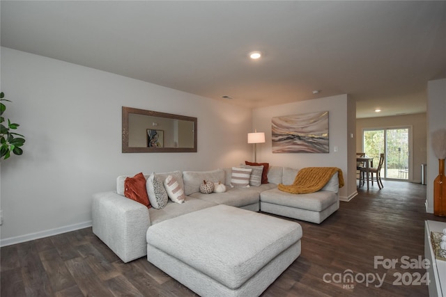 living room with dark hardwood / wood-style floors