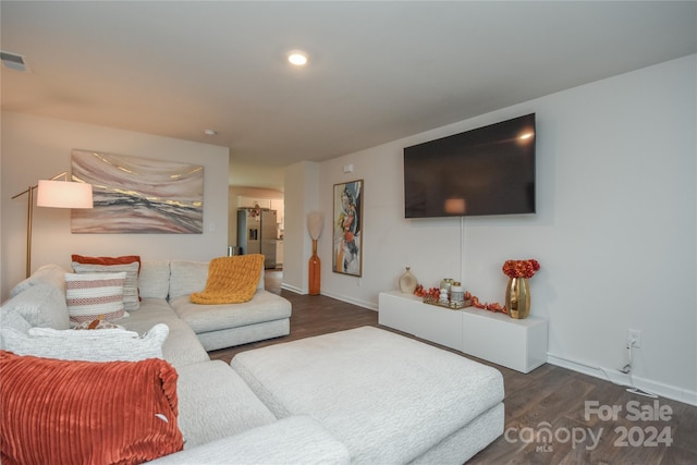 living room with dark hardwood / wood-style floors