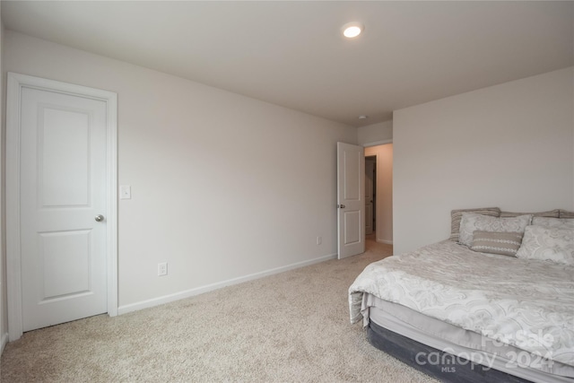 bedroom with light colored carpet