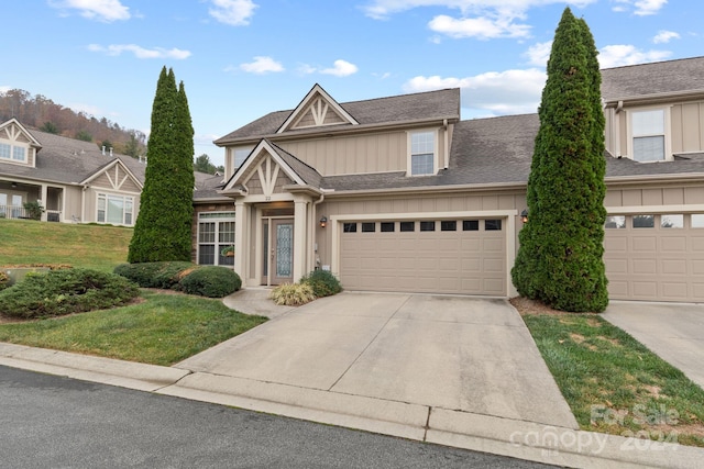 view of front of property with a garage and a front yard