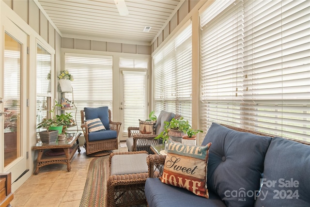 sunroom featuring wooden ceiling