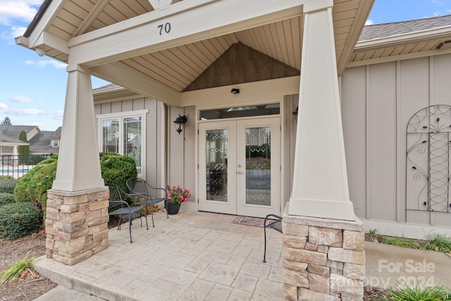 property entrance featuring french doors