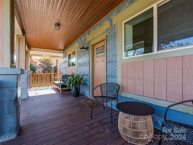 wooden terrace featuring a porch