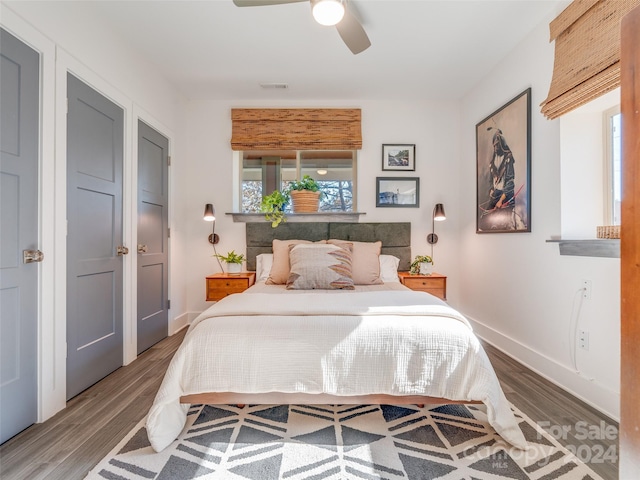 bedroom with wood-type flooring and ceiling fan