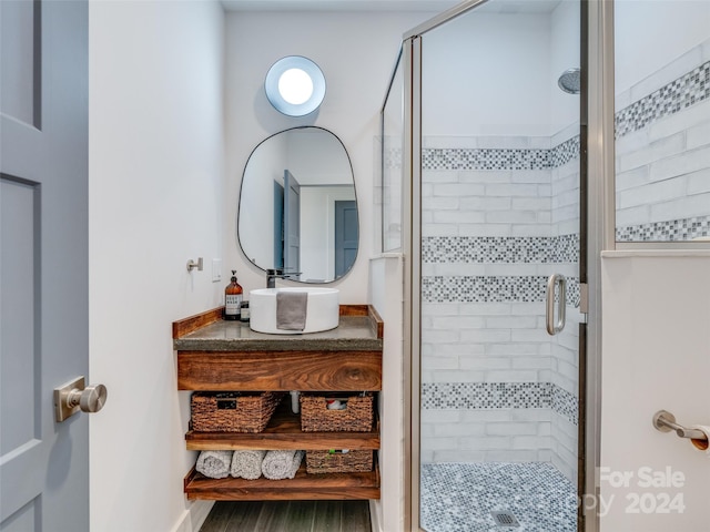 bathroom with a shower with shower door