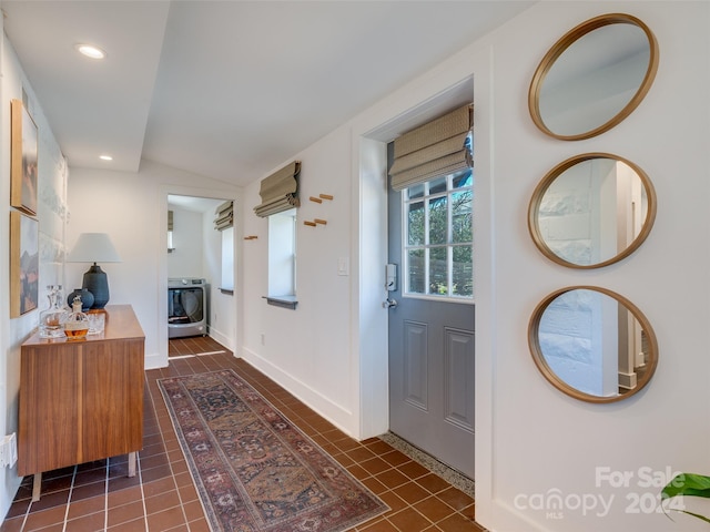 interior space with vaulted ceiling and washer / dryer