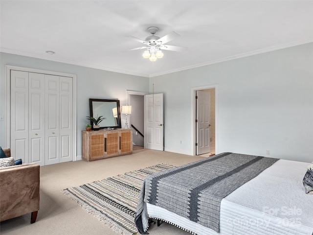 bedroom with baseboards, light colored carpet, ceiling fan, crown molding, and a closet