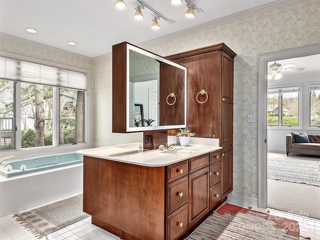 ensuite bathroom featuring plenty of natural light, tile patterned flooring, and wallpapered walls