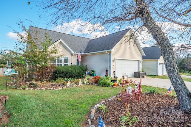 view of front facade with a garage and a front lawn