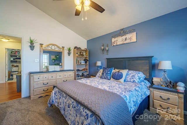 bedroom featuring ceiling fan, high vaulted ceiling, and dark carpet