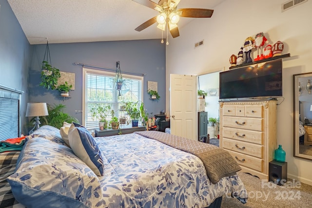 bedroom featuring ceiling fan, carpet floors, a textured ceiling, and high vaulted ceiling