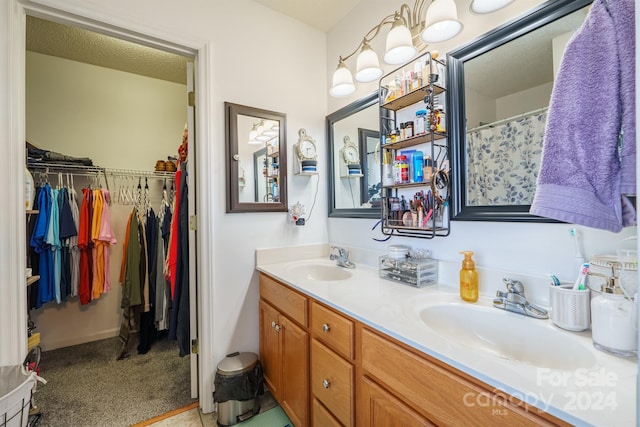 bathroom with a textured ceiling and vanity