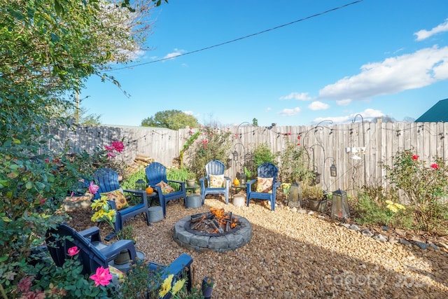 view of yard with an outdoor fire pit