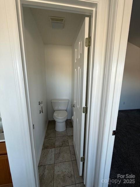 bathroom with tile patterned floors and toilet