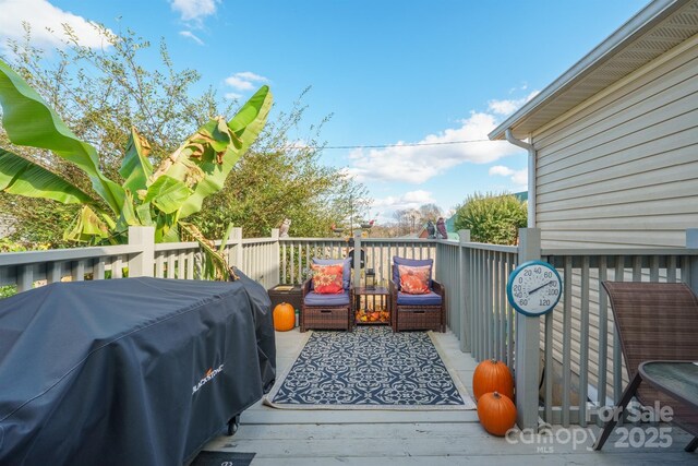 wooden deck with area for grilling