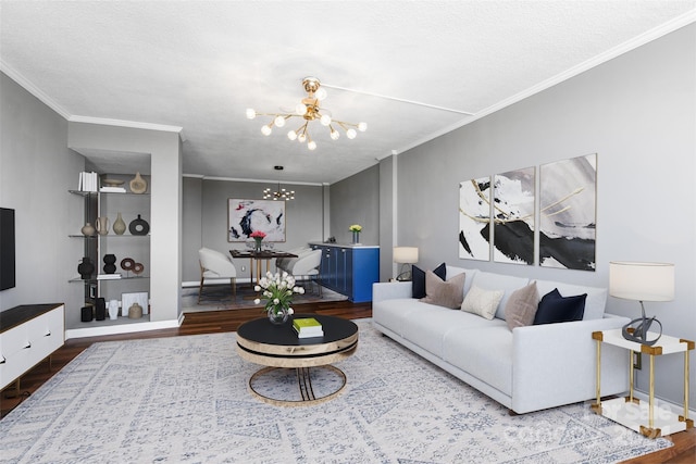 living room with wood-type flooring, a textured ceiling, crown molding, and an inviting chandelier