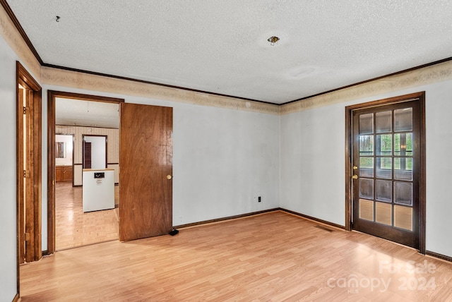 unfurnished room featuring crown molding, wood-type flooring, and a textured ceiling