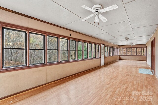 61 Doe Loop, Hot Springs, NC 28743 - unfurnished sunroom with baseboards and wood finished floors