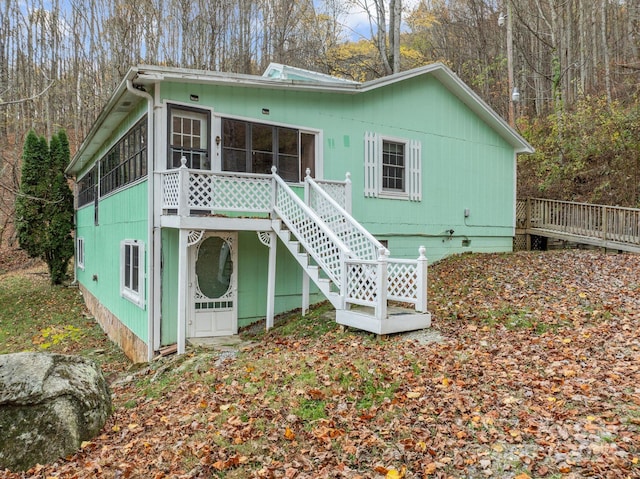 61 Doe Loop, Hot Springs, NC 28743 - back of property with a sunroom, a deck, stairs, and crawl space