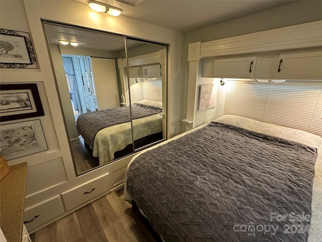 bedroom featuring a closet and wood-type flooring