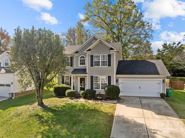 view of front of house featuring a garage and a front yard