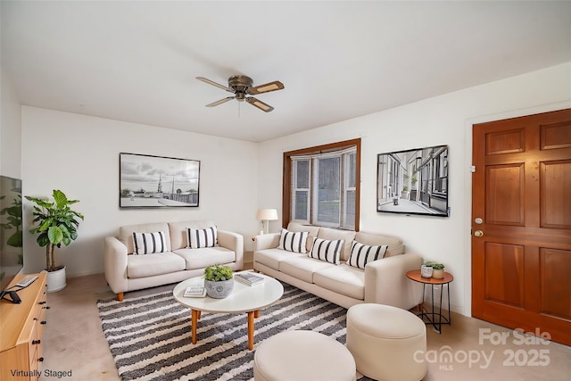 living room with light colored carpet and ceiling fan