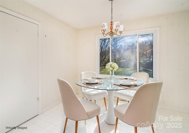 dining room with plenty of natural light and a chandelier