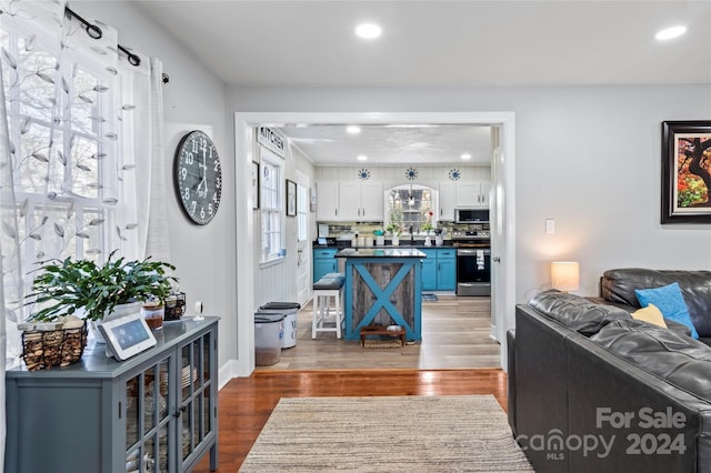 living room featuring dark wood-type flooring