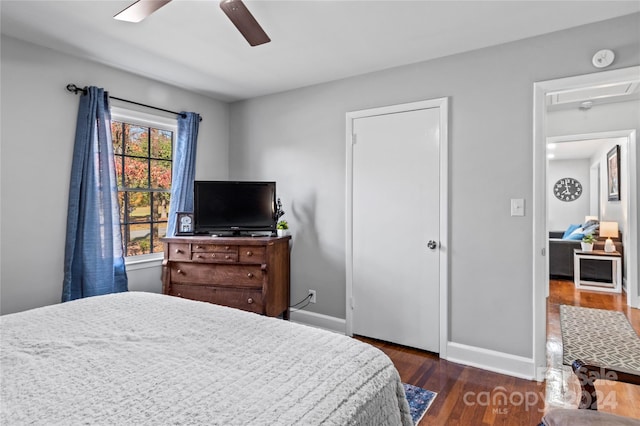 bedroom featuring ceiling fan and dark hardwood / wood-style flooring