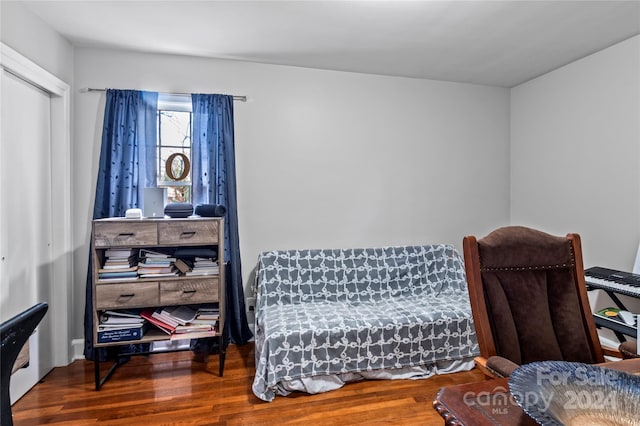 living area with hardwood / wood-style flooring