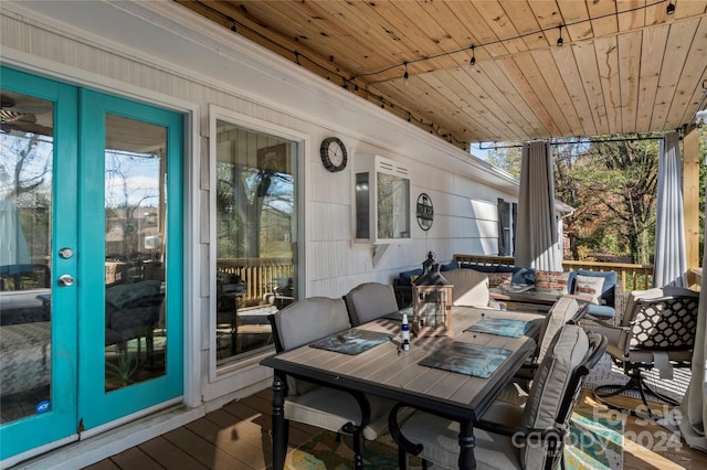 sunroom / solarium featuring wooden ceiling