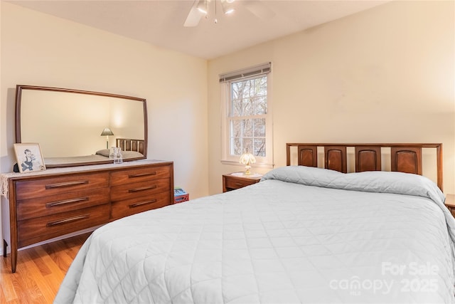 bedroom with wood finished floors and ceiling fan