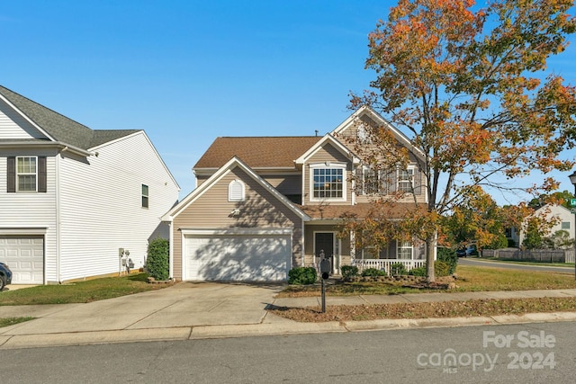 view of front facade featuring a porch and a garage