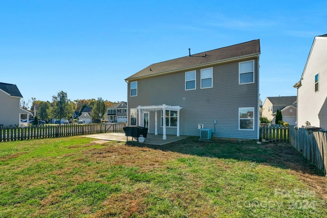 back of property featuring a yard, a pergola, and a patio