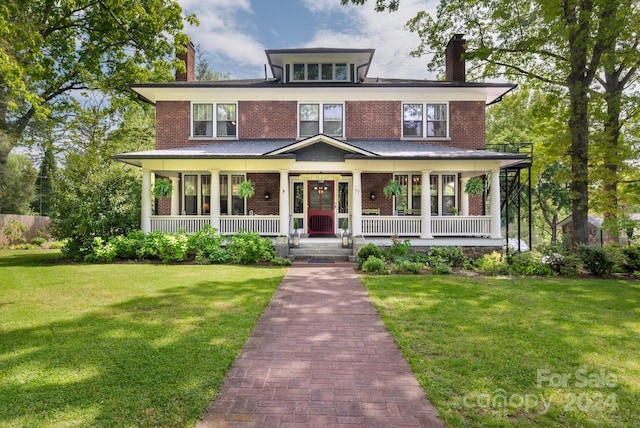 view of front of property featuring covered porch and a front yard