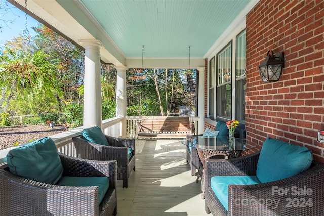 wooden deck featuring covered porch