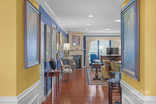 hallway featuring crown molding and dark hardwood / wood-style flooring