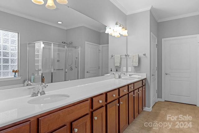 bathroom with vanity, a shower with shower door, tile patterned floors, and ornamental molding