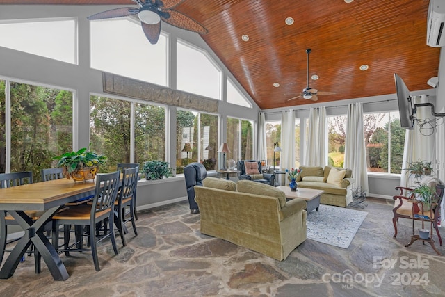 sunroom / solarium with ceiling fan, vaulted ceiling, and a healthy amount of sunlight