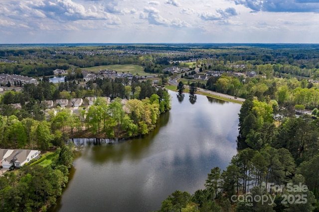 aerial view featuring a water view and a view of trees