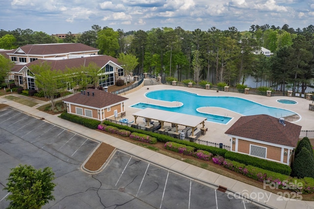 community pool featuring a community hot tub